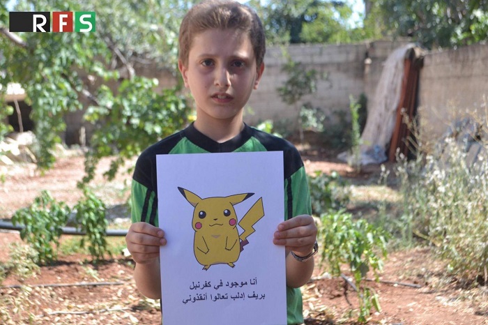 Syrian children hold Pokemon pictures in hope people will find them & save them